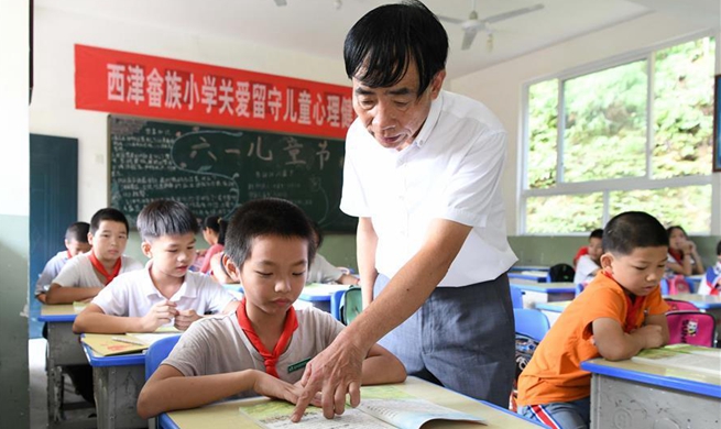 Pic story of boarding school principal in China's Fujian