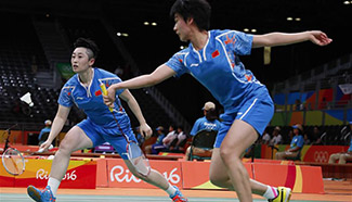 China's Yu Yang, Tang Yuanting win 2-1 during women's doubles group play stage match of badminton